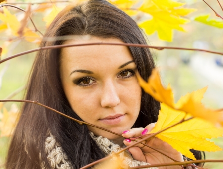 Young pretty woman in autumn parkの写真素材