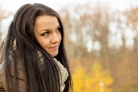 Young pretty woman in autumn parkの写真素材