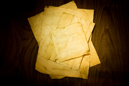old paper on wood backgroundの写真素材