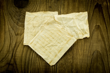 old paper on wood backgroundの写真素材