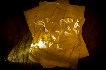 old paper on wood backgroundの写真素材