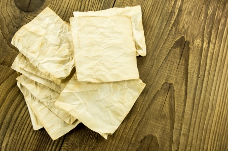 old paper on wood backgroundの写真素材