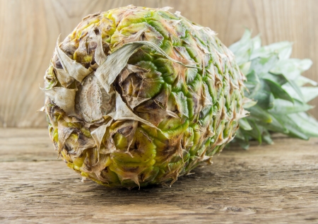 Pineapples on wooden grunge backgroundの写真素材