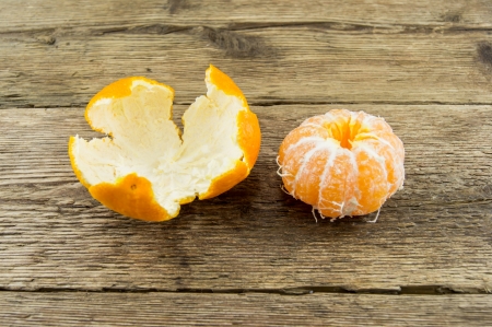 Ripe tangerines on wooden backgroundの写真素材