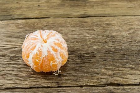 Ripe tangerines on wooden backgroundの写真素材