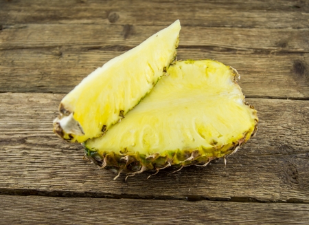 pineapple sliced ââon a wooden backgroundの写真素材