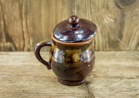 closeup of cup with tea in asian style on wooden desk and wooden backgroundの写真素材