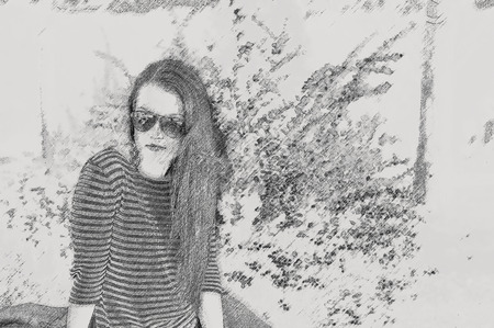 Young pretty woman in park. Effect pencilの写真素材