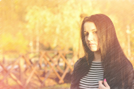 Young pretty woman in autumn park young