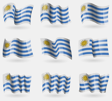 Set of Uruguay flags in the air. Vector illustrationのイラスト素材