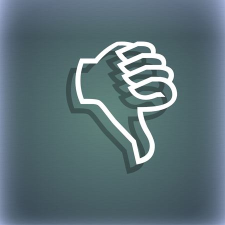 Dislike sign icon. Thumb down sign. Hand finger down symbol. On the blue-green abstract background with shadow and space for your text. illustrationの写真素材