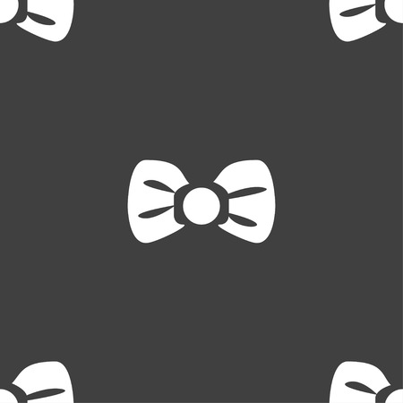 Bow tie icon sign. Seamless pattern on a gray background. Vector illustrationのイラスト素材