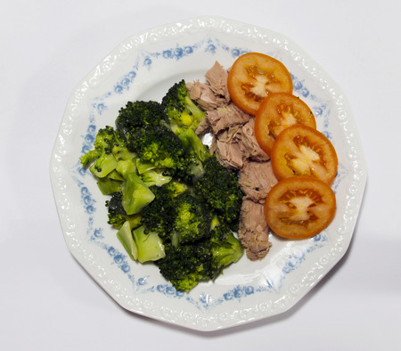 Plate with broccoli tomatoes and tunaの写真素材