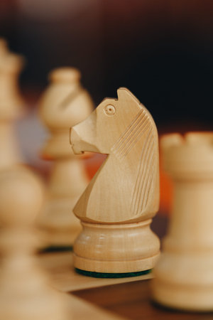 Staunton White Chess Pieces on Chess Board. A set of traditional Staunton boxwood white chess pieces...