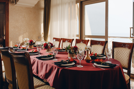 Festive decor tableware card free space inscription. Festive decor on the table with tableware and a business card with free space for an inscriptionの写真素材