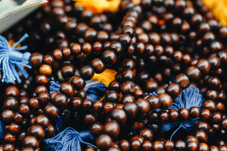wooden beads of round beads with blue tails close-up.の写真素材