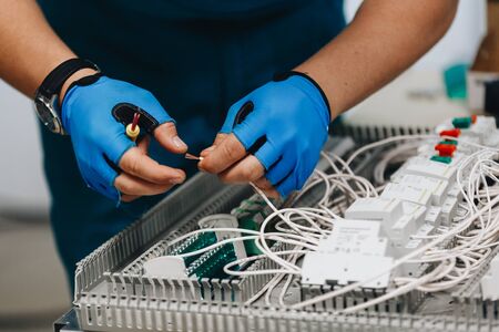 Electrician Working On Electrical Panel.の写真素材