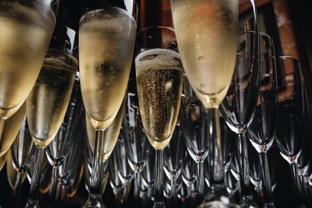 Close-up the glasses of the champagne on a table.の写真素材