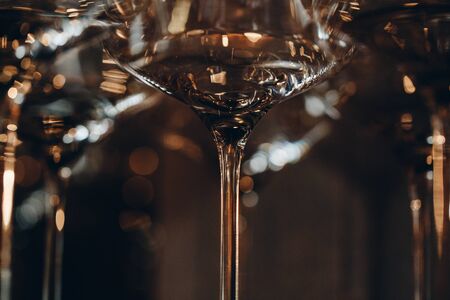 Empty clean champagne glasses on counter in barの写真素材