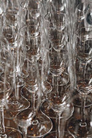 Empty clean champagne glasses on counter in barの写真素材