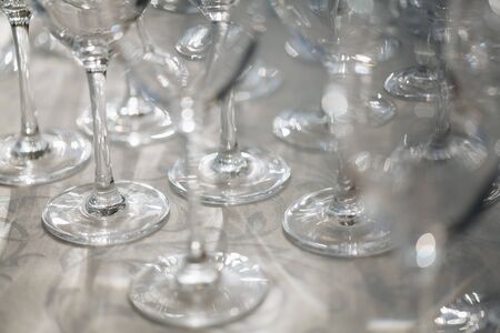 Empty wine glasses closeup. In a row, focus on foreground.の写真素材