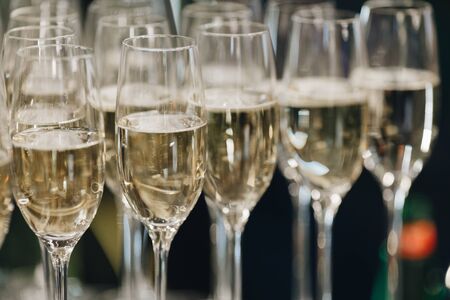 glasses of white sparkling wine champagne lot of close-upsの写真素材