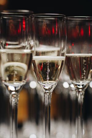 glasses of white sparkling wine champagne lot of close-ups.の写真素材