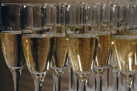 glasses of white sparkling wine champagne lot of close-upsの写真素材