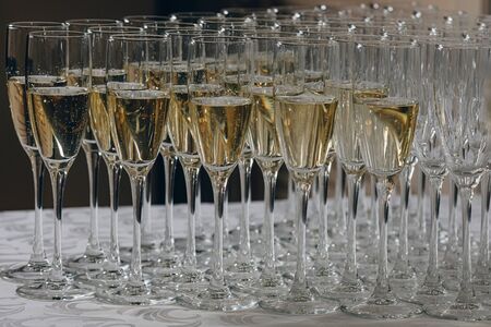 glasses of white sparkling wine champagne lot of close-upsの写真素材