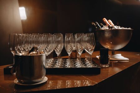 Empty clean champagne glasses on counter in barの写真素材