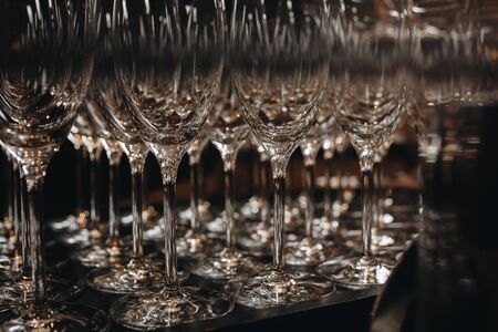 Empty clean champagne glasses on counter in barの写真素材