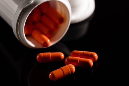 Pharmacy background on a dark table. Levitation pills.の写真素材