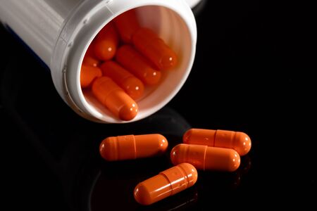 Pharmacy background on a dark table. Levitation pills.の写真素材