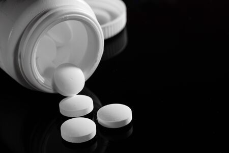 Pharmacy background on a dark table. Levitation pills.の写真素材