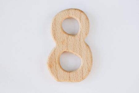wooden figure number eight isolated on white backgroundの写真素材