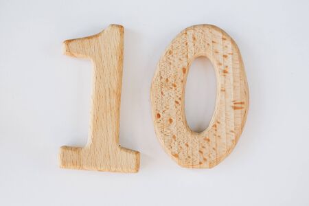 wooden figure number ten isolated on white backgroundの写真素材