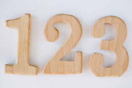 wooden figure number one, two, three isolated on white backgroundの写真素材