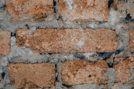 old vintage background of red brick wall close-up.
