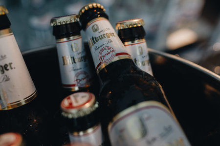 Sochi, Russia - march 18, 2020: bitburger beer bottles in a bucket with ice during a catering event.のeditorial素材