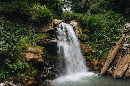 Majestic waterfall in the mountains of Russiaの写真素材