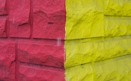 Pink and yellow wallの写真素材