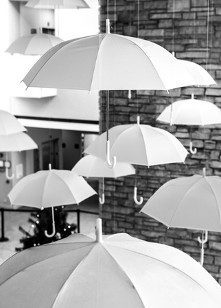 Hanging white umbrellasの写真素材