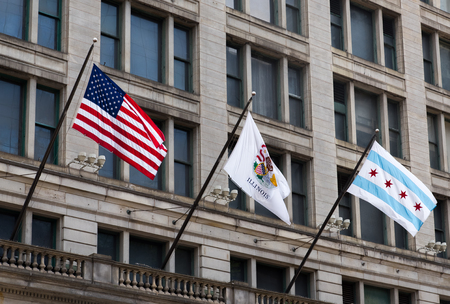 American flag on a street of Chicago downtownの写真素材