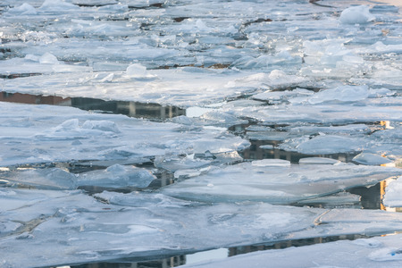 Broken ice on a frozen Chicago riverの写真素材