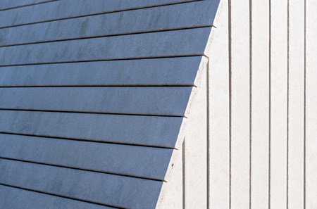 White wooden wall with a shadow - vertical linesの写真素材