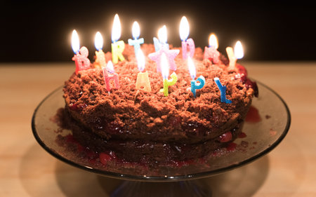 Chocolate birthday cake with candles on it