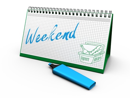 desktop calendar for notes with the words  weekend  and lying next markerの写真素材