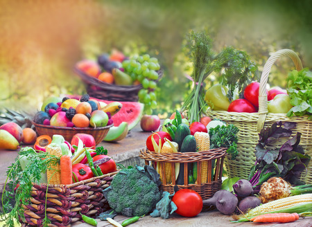 Fruits and vegetables in wicker basketsの写真素材
