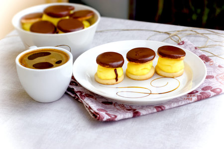 Cream cake and black coffee, coffee breaks and treat for pleasure