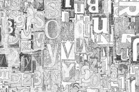 Black and white alphabet, letters and numbers as backgroundの写真素材
